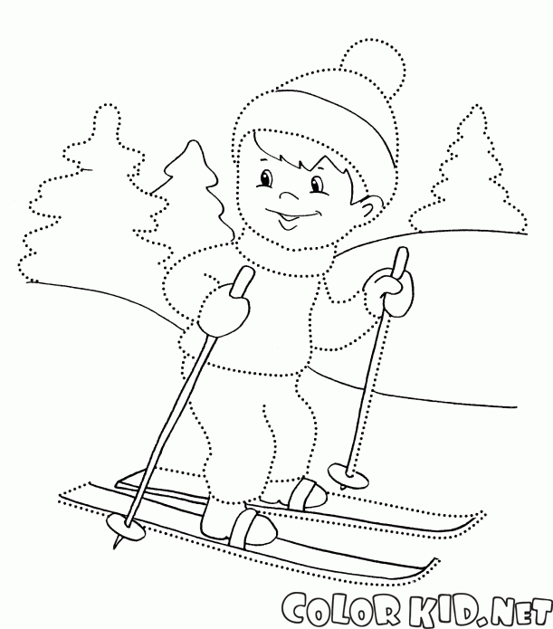 Boy skiing in the woods