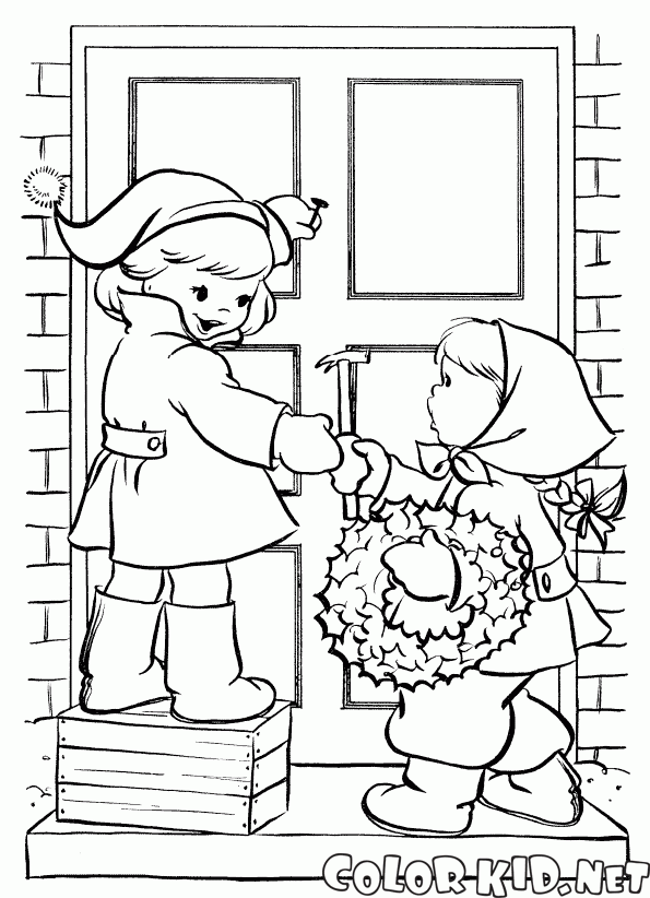 Children hang a wreath